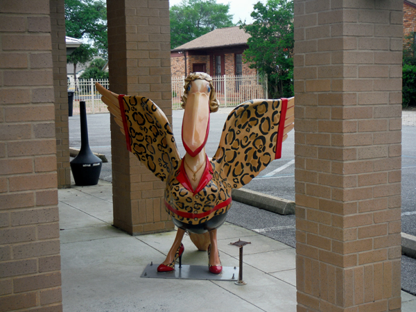pelican statue in red heels